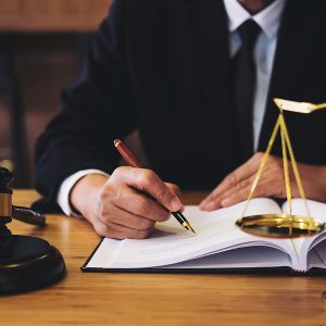 Personal Injury Lawyer, Judge gavel with Justice lawyers Businessman in suit or lawyer working on a documents. Legal law advice and justice concept.