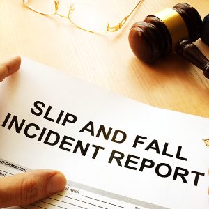 Slip and Fall Accident Attorney, Slip and fall injury report on a table.