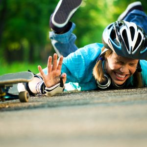 Recreational Sports Injury, Beautiful teenage girl with skateboard in the green park