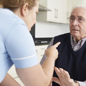 The Role of a Nursing Home Negligence Lawyer in Cases of Emotional Abuse, Female Care Worker Mistreating Frightened Elderly Man